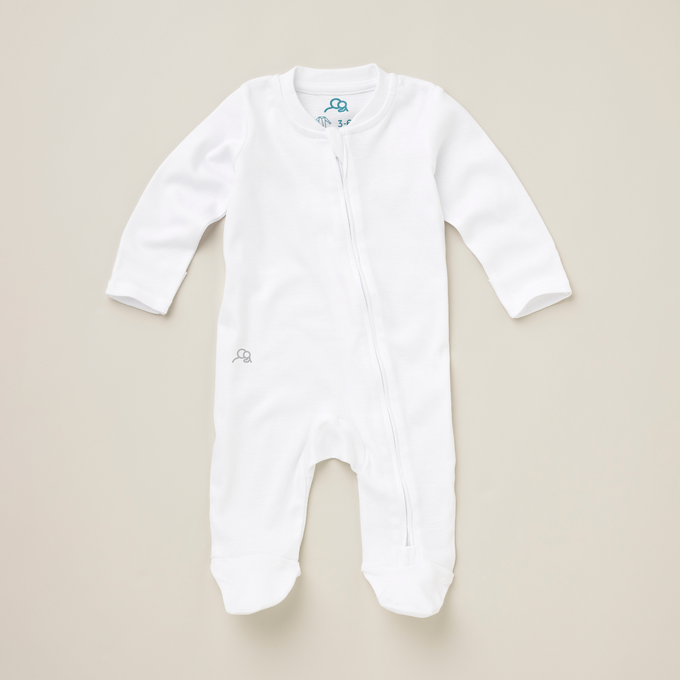 Singular white baby sleepsuit with small logo on right hip